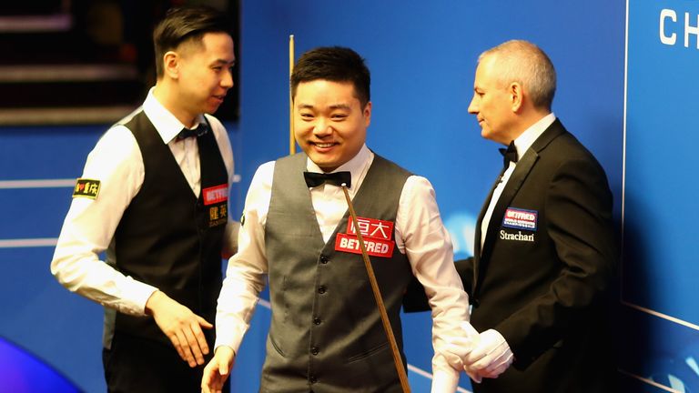 Ding Junhui of China walks off stage after winning his first round match against Xiao Guodong of China of during day four of the World Snooker Championship at Crucible Theatre on April 23, 2018 in Sheffield, England.