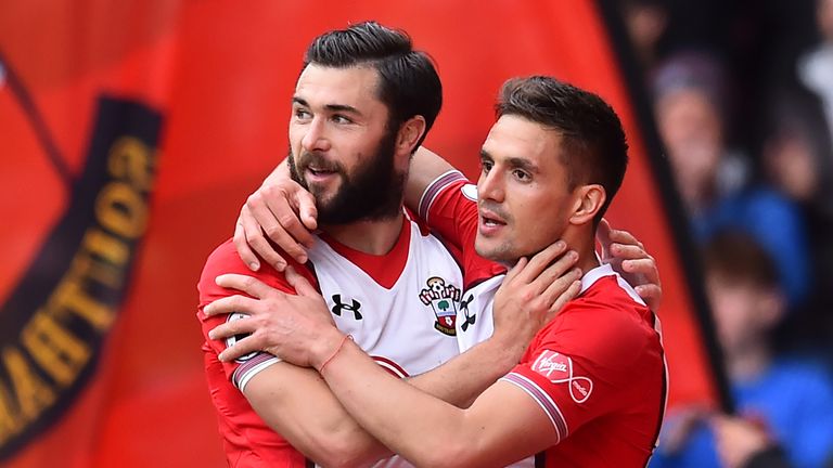Dusan Tadic celebrates his first goal with teammate Charlie Austin