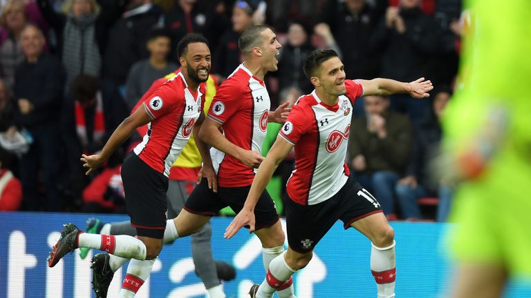 Dusan Tadic celebrates with Nathan Redmond and Oriol Romeu after putting Southampton back in front at St Mary's
