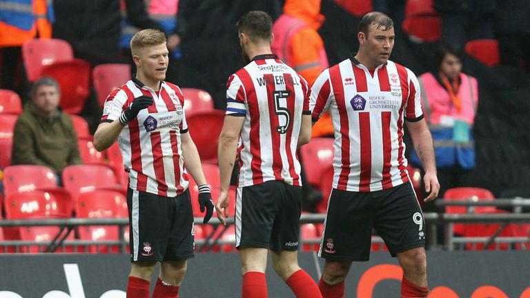 Elliot Whitehouse of Lincoln City celebrates scoring his sides first goal with his team mates during the Checkatrade Trophy Final