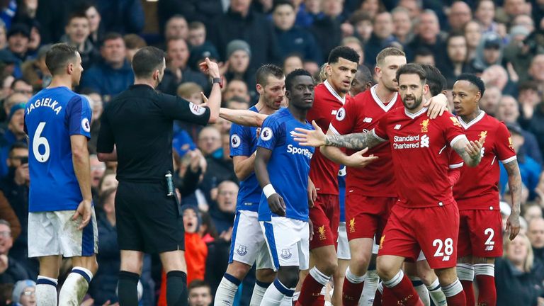 Players form both sides come together during the Premier League match at Goodison Park on April 7, 2018