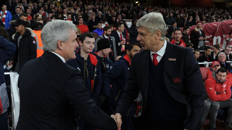 Mark Hughes and Arsene Wenger shake hands in 2016