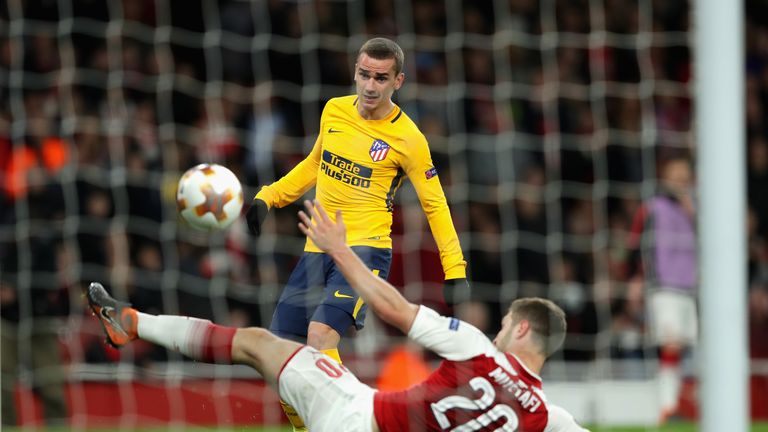 Antoine Griezmann lifts the ball over Shkodran Mustafi to equalise