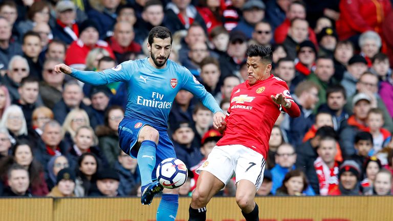 Arsenal's Henrikh Mkhitaryan (left) and Manchester United's Alexis Sanchez battle for the ball during the Premier League match v Arsenal at Old Trafford, Manchester.
