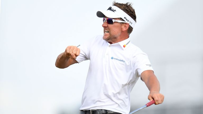 Ian Poulter thumps his chest after holing a birdie putt at the 18th at the Houston Open