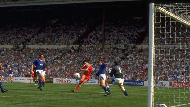 Ian Rush beats goalkeeper Neville Southall of Everton to score their second goal during the FA Cup final at Wembley Stadium in London. Liverpool won the match 3-2.