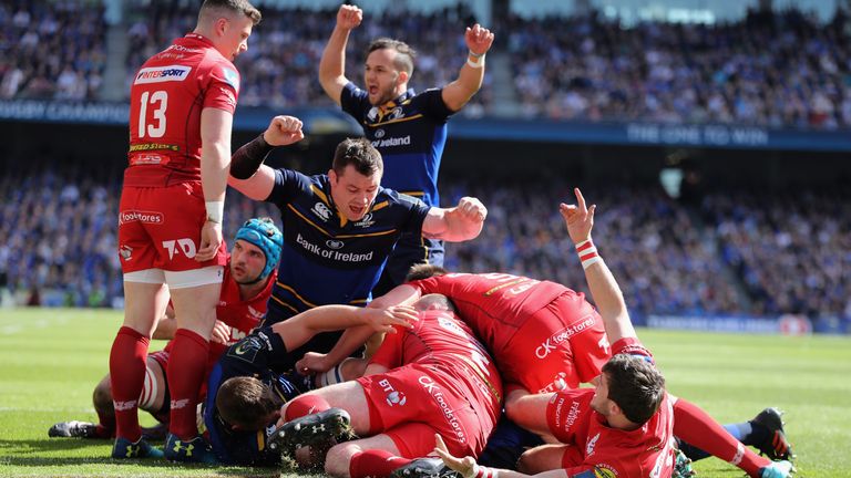 Leinster's Jamison Gibson-Park celebrates as James Ryan dives over for the first try against Scarlets
