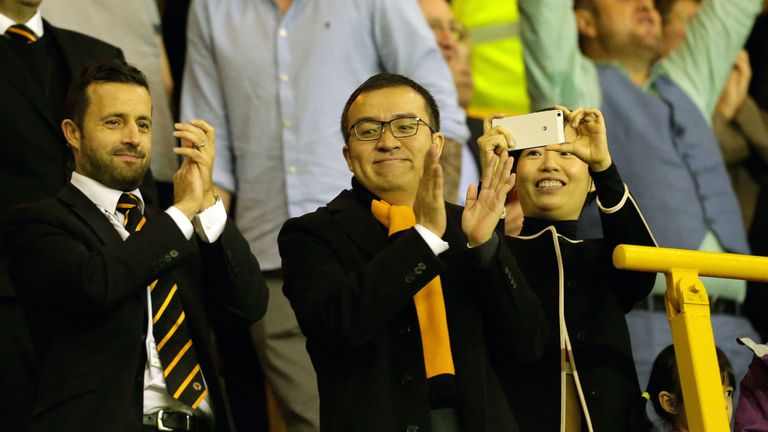 Wolverhampton Wanderers managing director Laurie Dalrymple (left) and chairman Jeff Shi applaud their side during the Sky Bet Championship match between Wolverhampton and Aston Villa at Molineux on October 14, 2017