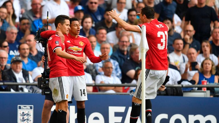 Ander Herrera celebrates with Jesse Lingard and Nemanja Matic after scoring Manchester United's second goal against Tottenham