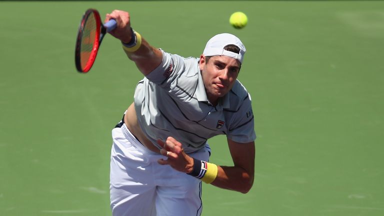John Isner of the United States serves against Juan Martin Del Potro of Argentina in their semifinal match during the Miami Open Presented by Itau at Crandon Park Tennis Center on March 30, 2018 in Key Biscayne, Florida