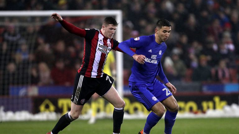 Sheffield United's John Lundstram (left) and Cardiff City's Marko Grujic battle for the ball