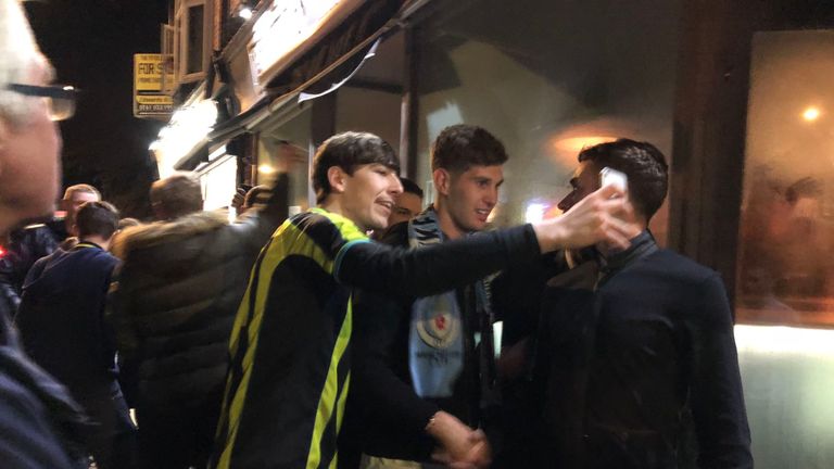 John Stones was met by fans as he entered a Manchester bar