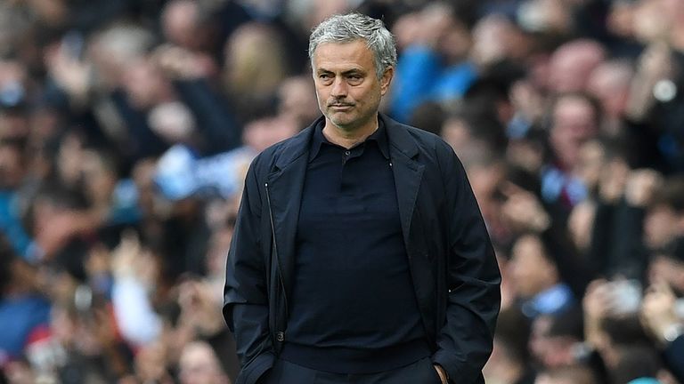 Jose Mourinho looks on from the touchline with his team two goals behind in the Manchester derby