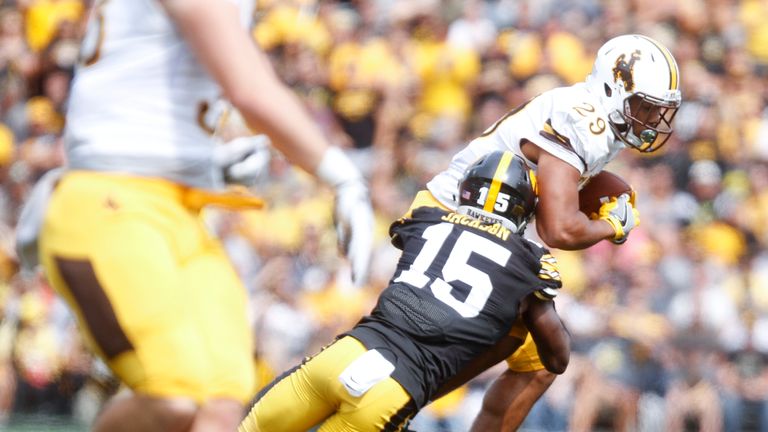 IOWA CITY, IOWA- SEPTEMBER 2:  Running back Kellen Overstreet #29 of the Wyoming Cowboys is brought down during the second quarter by defensive back Joshua Jackson #15 of the Iowa Hawkeyes, on September 2, 2017 at Kinnick Stadium in Iowa City, Iowa.  (Photo by Matthew Holst/Getty Images) *** Local Caption *** Kellen Overstreet;Joshua Jackson