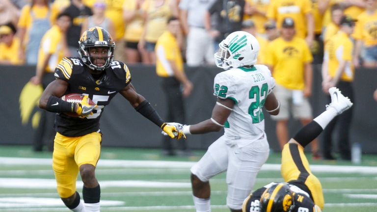 IOWA CITY, IOWA- SEPTEMBER 16:  Defensive back Josh Jackson #15 of the Iowa Hawkeyes returns a kick during the fourth quarter in front of linebacker E.J. Ejiya #22 of the North Texas Mean Green on September 16, 2017 at Kinnick Stadium in Iowa City, Iowa.  (Photo by Matthew Holst/Getty Images) *** Local Caption *** Josh Jackson;E.J. Ejiya