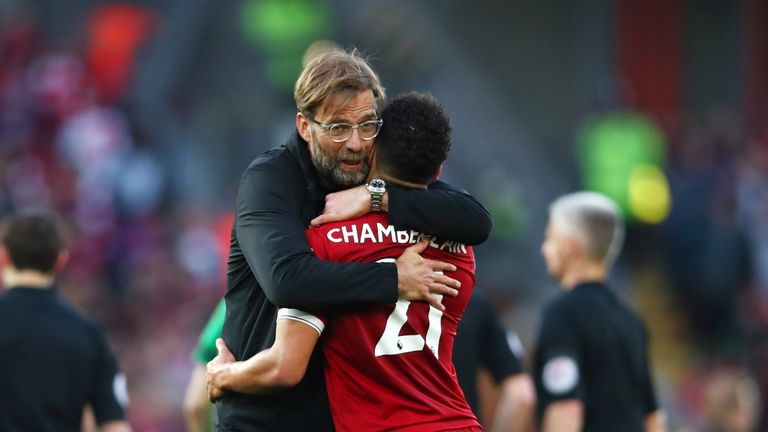 Jurgen Klopp celebrates the 3-0 victory over Bournemouth with Alex Oxlade-Chamberlain