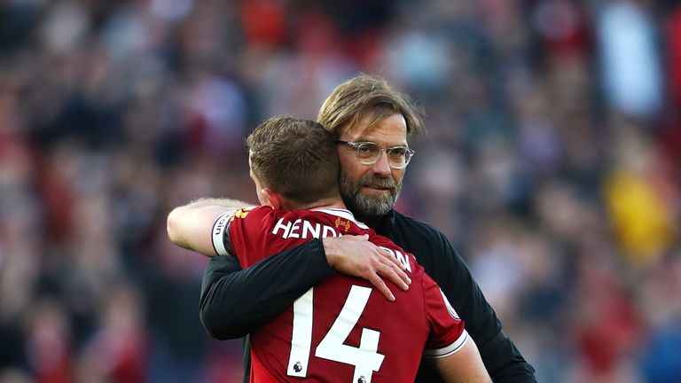 Jurgen Klopp celebrates the 3-0 victory over Bournemouth with Liverpool captain Jordan Henderson