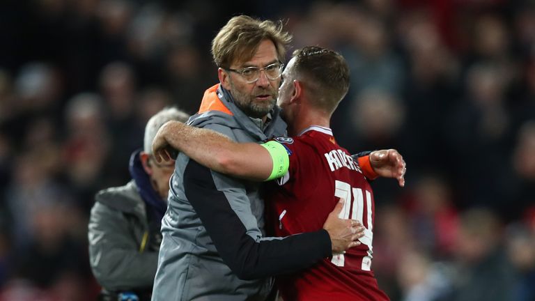 Jurgen Klopp embraces Liverpool captain Jordan Henderson after the 5-2 win over Roma