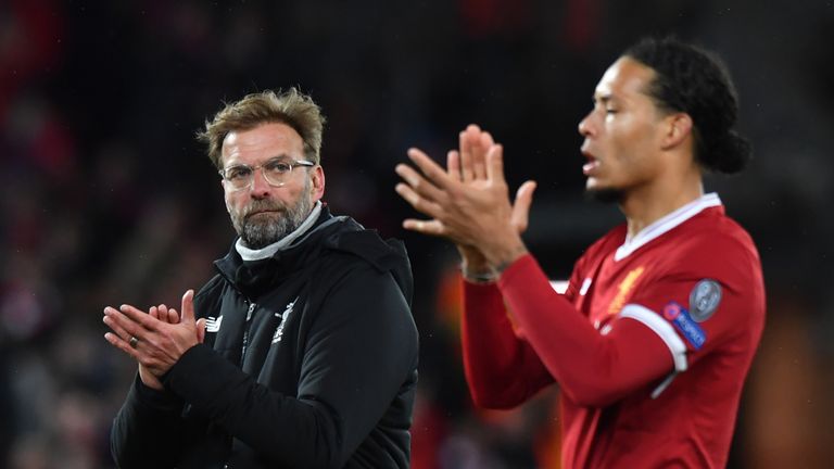 Jurgen Klopp and Virgil van Dijk applaud fans at the final following Liverpool's 3-0 win over Manchester City in the UEFA Champions League quarter-final 1st leg