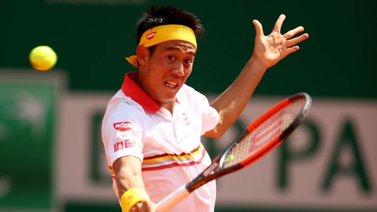 Kei Nishikori plays a backhand volley during his Men's singles match against Daniil Medvedev at the 2018 Monte-Carlo Masters