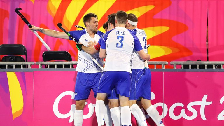 GOLD COAST, QUEENSLAND - APRIL 05: Kenneth Bain of Scotland celebrates with his team-mates after scoring a goal during the Mens Pool A Hockey match between South Africa and Scotland on day one of the Gold Coast 2018 Commonwealth Games at Gold Coast Hockey Centre on April 5, 2018 on the Gold Coast, Australia