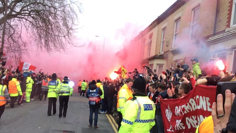 Liverpool fans use flares and smoke bombs outside Anfield