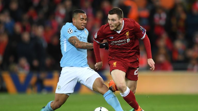 Andy Robertson of Liverpool is challenged by Gabriel Jesus of Manchester City 