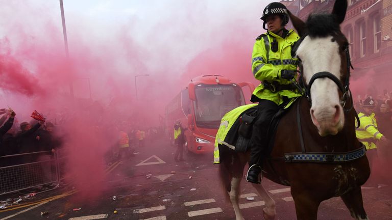Police keep control as Liverpool's team bus arrives before the UEFA Champions League quarter-final first leg between Liverpool and Manchester City
