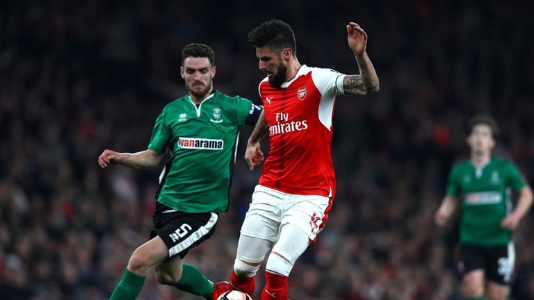 Luke Waterfall and Olivier Giroud during The Emirates FA Cup Quarter-Final match between Arsenal and Lincoln City at Emirates Stadium on March 11, 2017 in London, England.