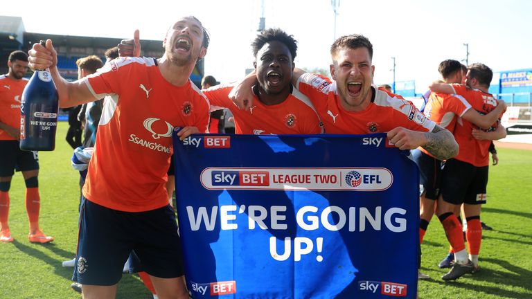 Luton Town's Danny Hylton (left), Pelly Ruddock-Mpanzu (centre) and James Collins celebrate promotion