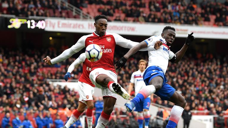 Mame Biram Diouf of Stoke City battles for possession with Danny Welbeck of Arsenal during the Premier League match between Arsenal and Stoke City at Emirates Stadium on April 1, 2018 in London, England.