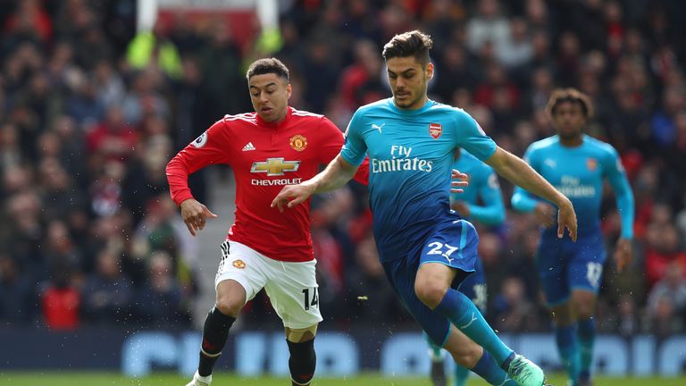 Konstantinos Mavropanos of Arsenal is challenged by Jesse Lingard of Manchester United during the Premier League match between Manchester United and Arsenal at Old Trafford on April 29, 2018 in Manchester, England. 