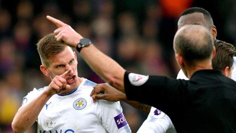 Leicester City's Marc Albrighton reacts to being shown a red card by referee Mike Dean