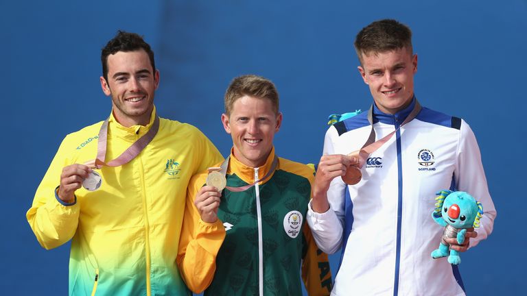 (L-R) Silver medalist Jacob Birtwhistle of Australia, gold medalist Henri Schoeman of South Africa and bronze medalist Marc Austin of Scotland