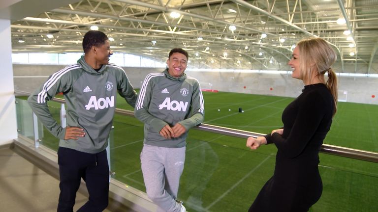 Jesse Lingard and Marcus Rashford with Laura Woods