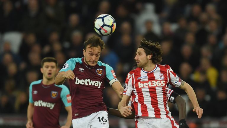 Mark Noble and Joe Allen during the Premier League match between West Ham and Stoke City at London Stadium