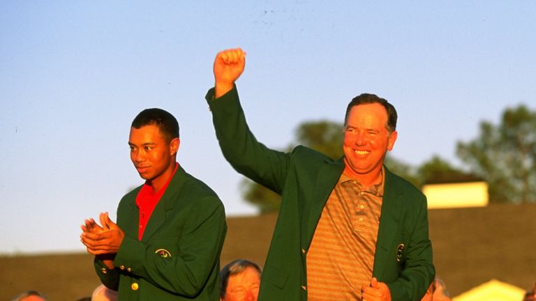 Mark O'Meara celebrates his victory in the 1998 Masters as Tiger Woods looks on 