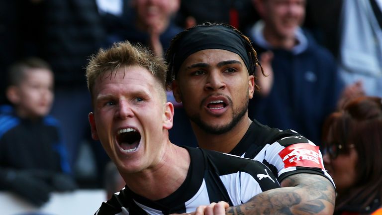 Matt Ritchie of Newcastle United celebrates after scoring his side's second goal with DeAndre Yedlin during the Premier League match v Arsenal at St. James Park
