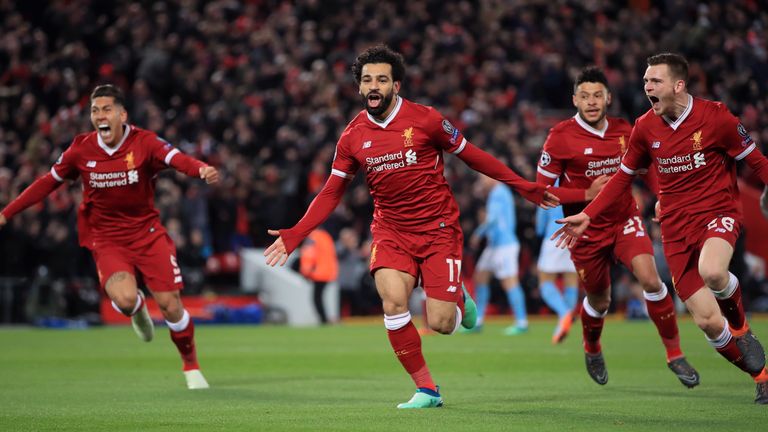 Liverpool's Mohamed Salah (centre) celebrates scoring his side's first goal of the game during the UEFA Champions League quarter final, first leg match v Manchester City at Anfield, Liverpool.