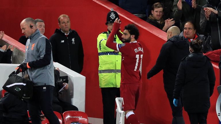 Mohamed Salah applauds the fans as he leaves the field at Anfield