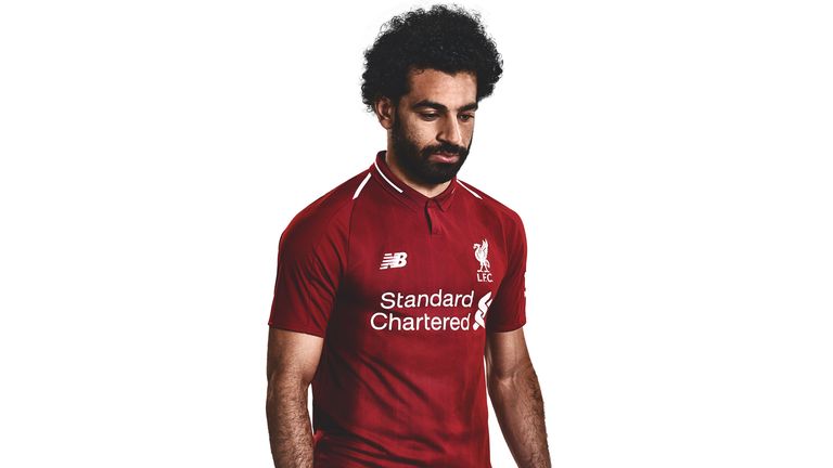 Mohamed Salah models Liverpool's 2018/19 kit