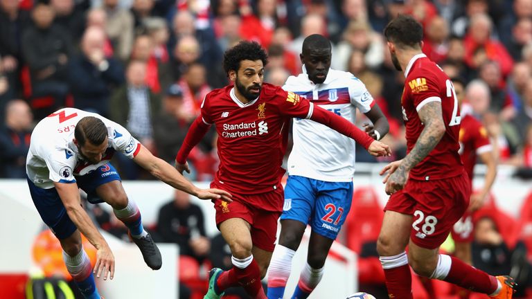 Mohamed Salah goes past Erik Pieters and Badou Ndiaye during the Premier League match at Anfield