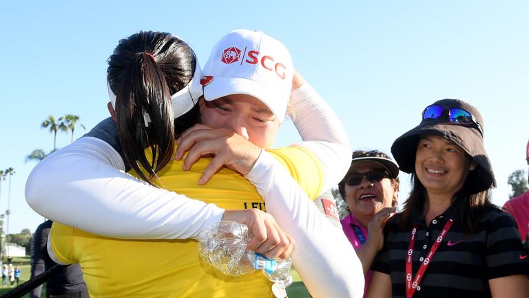 Moriya Jutanugarn shares  a hug with sister Ariya after winning the US Open