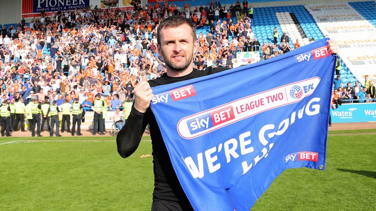Luton Town manager Nathan Jones celebrates winning promotion (Credit: Joe Dent/JMPUK)