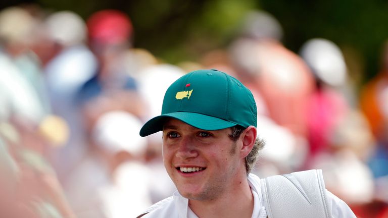 Niall Horan caddied for Rory McIlroy during the par-three contest prior to the start of the 2015 Masters 