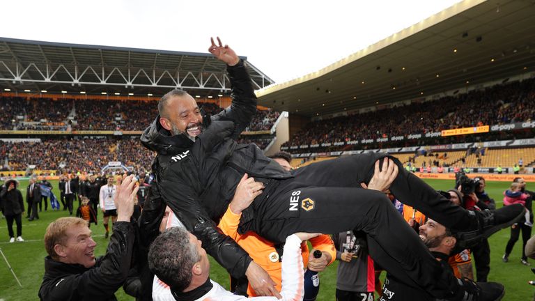 Wolverhampton Wanderers manager Nuno Espírito Santo is carried across the pitch during celebrations at Molineux on April 28, 2018