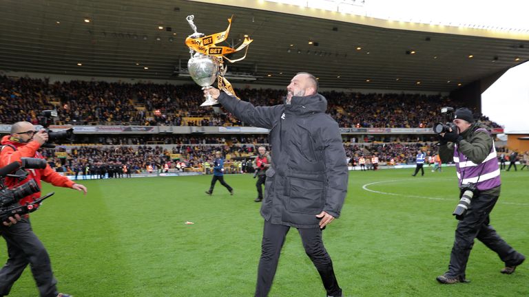 Wolverhampton Wanderers manager Nuno Espirito Santo celebrates with the Sky Bet Championship trophy at Molineux