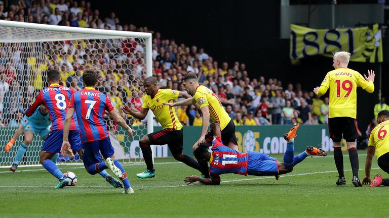 Wilfried Zaha hit the deck after a challenge from Adrian Mariappa