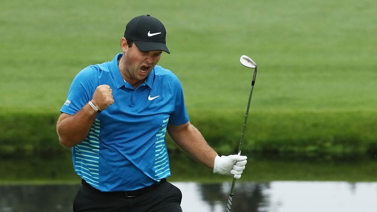 Patrick Reed celebrates after making an eagle on the 15th during the third round of the 2018 Masters Tournament at Augusta National Golf Club