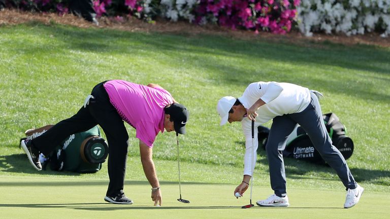 Patrick Reed and Rory McIlroy during the final round of the 2018 Masters Tournament at Augusta National Golf Club